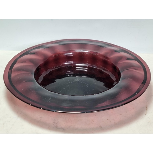 903 - Studio Glass to include, a black glass Candle Holder, an amethyst coloured glass shallow Bowl, 11.5