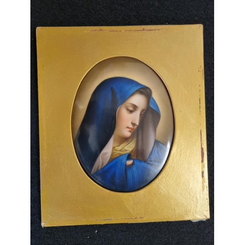 906 - A framed oval Porcelain Panel painted face of Madonna with blue headress, 5in x 3 3/4in