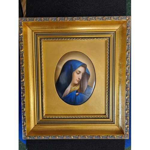 906 - A framed oval Porcelain Panel painted face of Madonna with blue headress, 5in x 3 3/4in