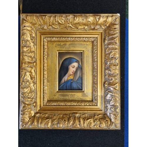 909 - A small painted oblong Panel of Madonna, blue headdress, in decorative gilt frame, 3 1/2 x 2 1/4in