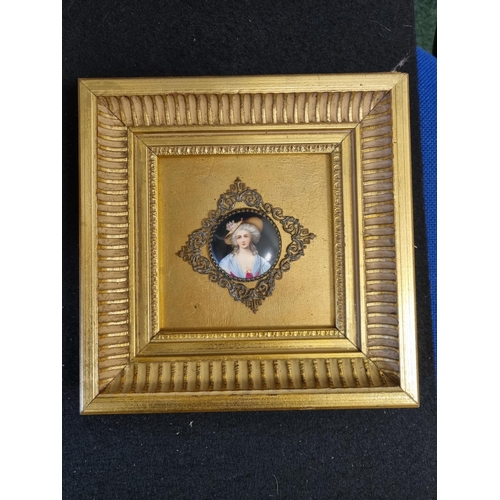 913 - A framed oval porcelain Panel of Young Boy, 3 1/2 x 2 3/4in, and a circular plaque painted lady wear... 