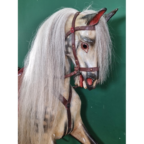 921 - A large carved and painted dapple grey Rocking Horse, with glass eyes, open mouth and flared nostril... 