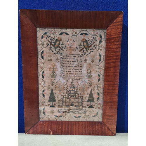 923 - An early 19th century needlework Sampler by Elizabeth Grainger aged 11 years with verse, temple, par... 