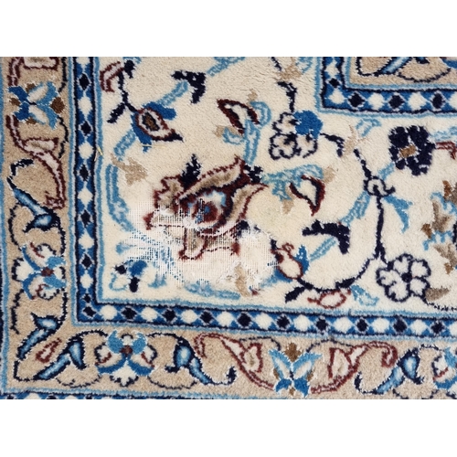 937 - A modern blue ground Persian style Rug with trailing floral design within cream and pink tramline bo... 