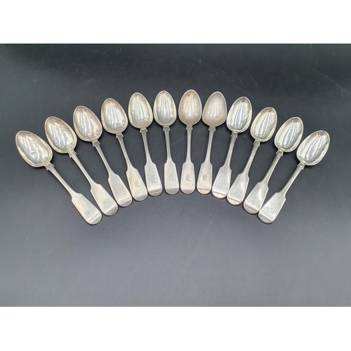 94 - A quantity of mainly 19th century silver Cutlery fiddle pattern, viz: 12 teaspoons, 4 dessert spoons... 