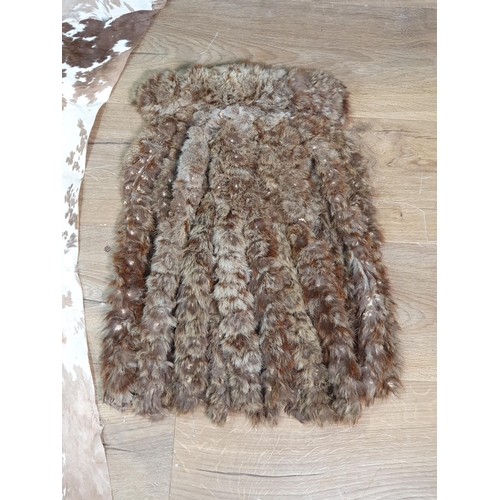 973 - A Zulu warriors calf skin backcloth - Ibeshu - and front covering of twisted fur - Slene.