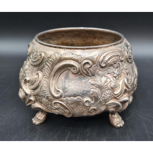 99 - A George V silver circular Sugar Bowl with floral and scroll embossing, engraved initials, London 19... 