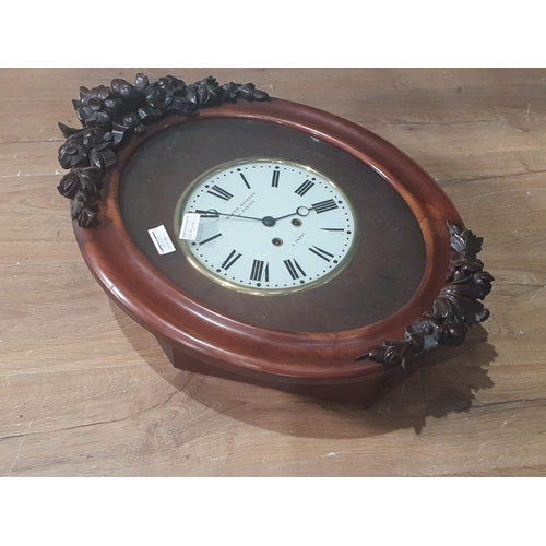 514 - A 19th Century French Wall Clock, oval with applied carved mounts, the circular dial inscribed 'Mart... 