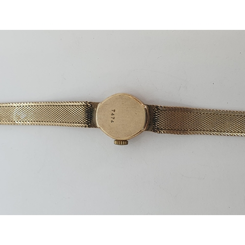 121 - A lady's Limit Wristwatch the gold dial with hourly baton markers, case width approx 15mm on 9ct gol... 