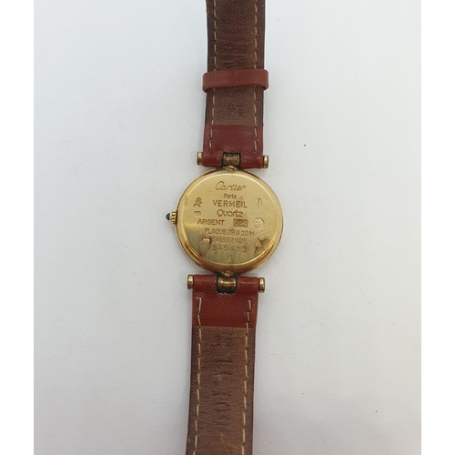 123 - A Vintage (1980s) lady's Must de Cartier Wristwatch having champagne dial with applied gold coloured... 