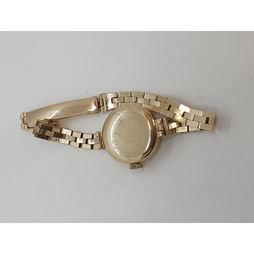 129 - A lady's vintage Majex Wristwatch the champagne enamel dial having applied gold Arabic numerals in 9... 