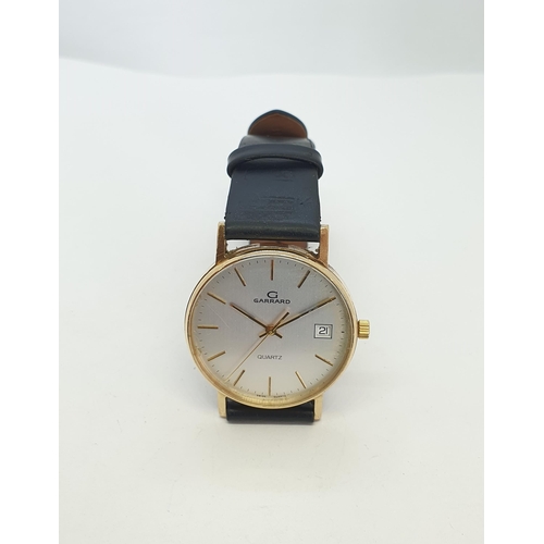 136 - A gentleman's 1970s Garrard quartz Wristwatch the brushed effect dial with hourly baton markers, sec... 