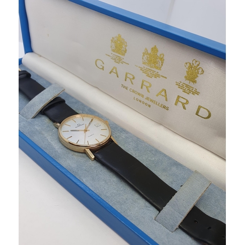 136 - A gentleman's 1970s Garrard quartz Wristwatch the brushed effect dial with hourly baton markers, sec... 