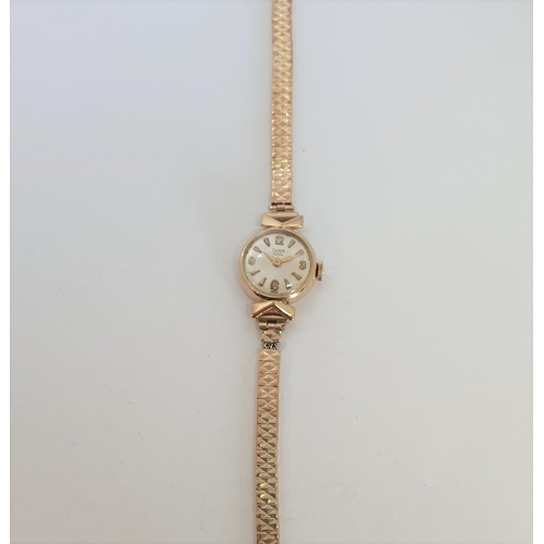 142 - A lady's 1980's Omega Quartz Wristwatch the square champagne dial with hourly baton markers in 9ct g... 