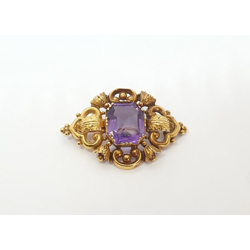 161 - A Victorian Amethyst Brooch claw-set mixed-cut stone in openwork acanthus leaf and scrolled frame, a... 