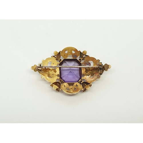 161 - A Victorian Amethyst Brooch claw-set mixed-cut stone in openwork acanthus leaf and scrolled frame, a... 