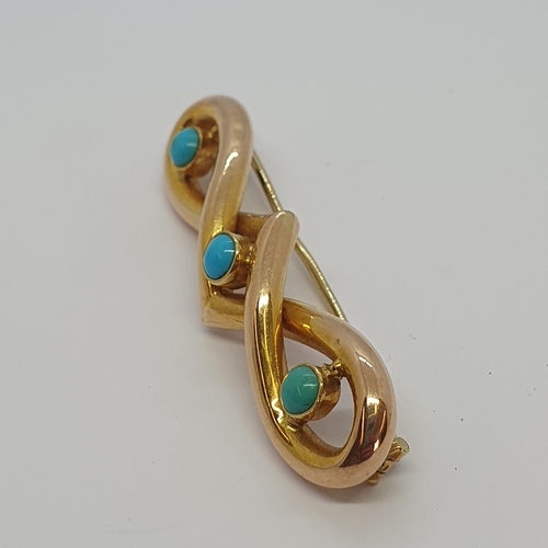 172 - A gold Knot Brooch set three turquoise cabochons, approx 45mm long, approx 3.80gms