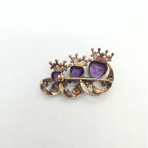 174 - An Antique Amethyst & Diamond Brooch set three heart shaped mixed cut amethysts set in gold (tests a... 