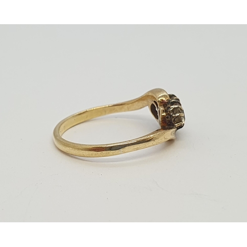 179 - A Diamond two stone crossover Ring claw-set old-cut stones, stamped 18ct, ring size M, approx 2.70gm... 