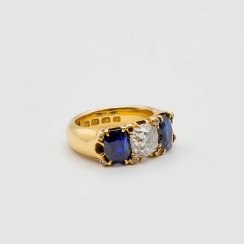 193 - A fine Victorian Diamond & Burmese Sapphire Three Stone Ring claw-set cushion-cut diamond flanked by... 