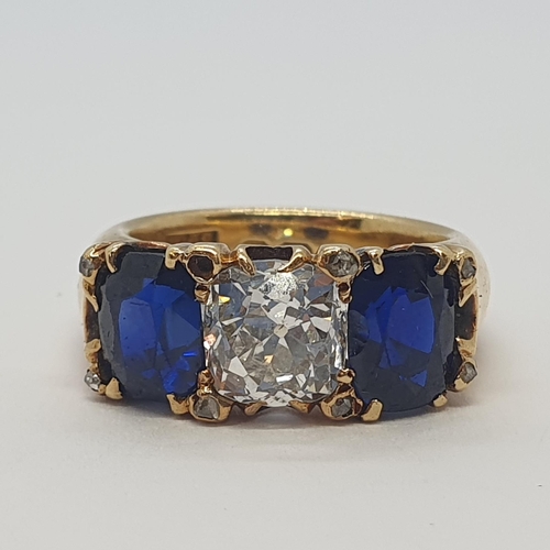 193 - A fine Victorian Diamond & Burmese Sapphire Three Stone Ring claw-set cushion-cut diamond flanked by... 