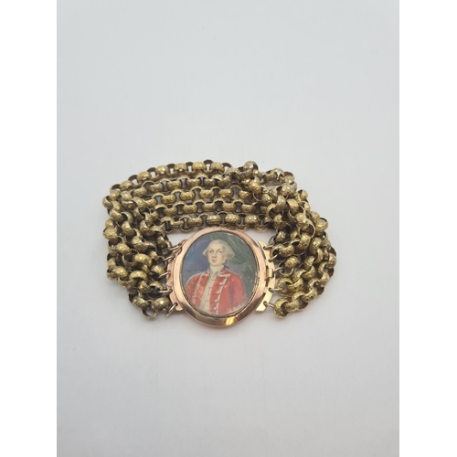 196 - An early 19th Century Mourning Bracelet painted portrait miniature on ivory of gentleman in red cour... 