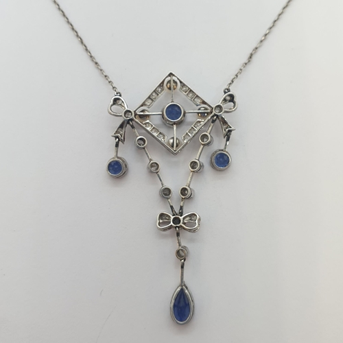 197 - An Edwardian Sapphire, Diamond and Seed Pearl Necklace the openwork bow plaque millegrain-set round ... 