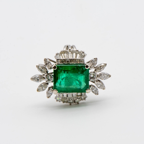 204 - An Emerald and Diamond Cocktail Ring corner claw-set octagonal mixed-cut emerald estimated 10.20cts,... 