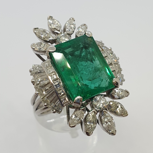 204 - An Emerald and Diamond Cocktail Ring corner claw-set octagonal mixed-cut emerald estimated 10.20cts,... 