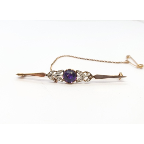 207 - An Amethyst and Diamond Bar brooch millegrain-set round amethyst between pairs of leaves set rose-cu... 