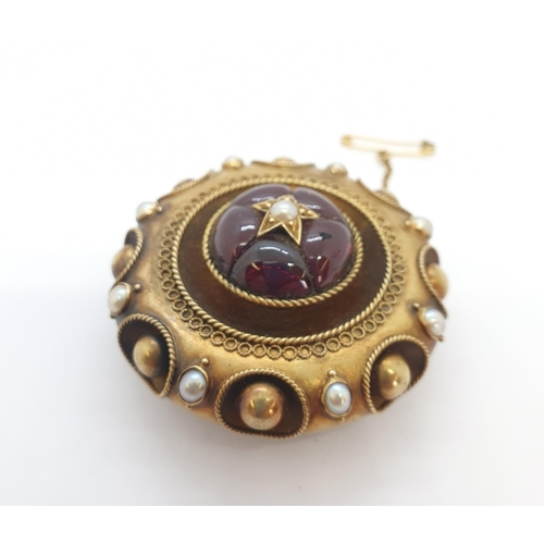 208 - A Victorian Almandine Garnet and Pearl Mourning brooch the circular plaque set carved garnet cabocho... 