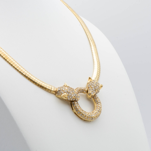 226 - A Diamond Necklace with Leopard Head terminals holding hoop, all pavé-set brilliant-cut diamonds on ... 