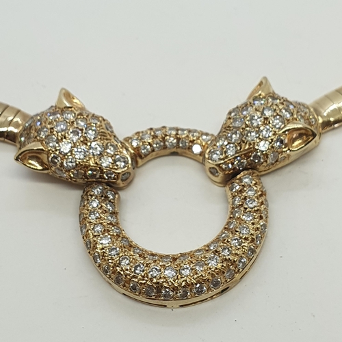 226 - A Diamond Necklace with Leopard Head terminals holding hoop, all pavé-set brilliant-cut diamonds on ... 