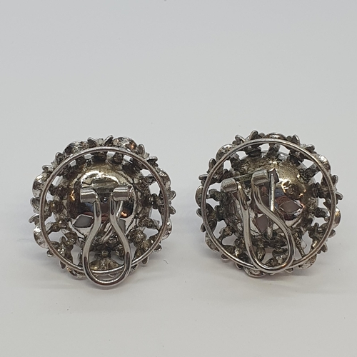 227 - A pair of Mabé Pearl Ear Clips each set large half pearl within  openwork frame formed as garland of... 