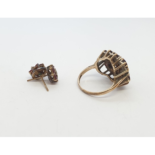 250 - A Cluster Dress Ring set red stones and diamonds chips and a pair of gilt metal Cluster Earrings set... 