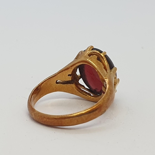 268 - A Garnet Ring claw-set oval cabochon, ring size, approx 4.30gms