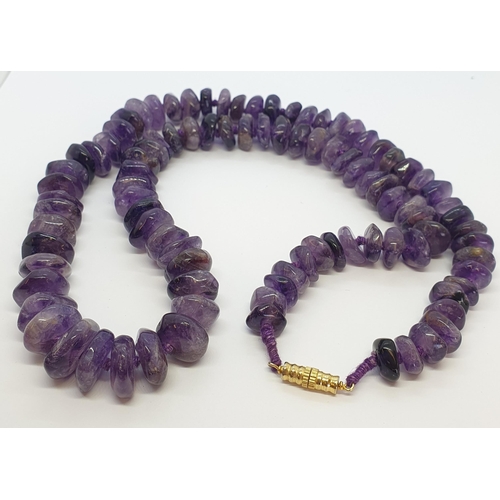 283 - A string of polished Amethyst beads and a small collection of Costume Jewellery including micro mosa... 