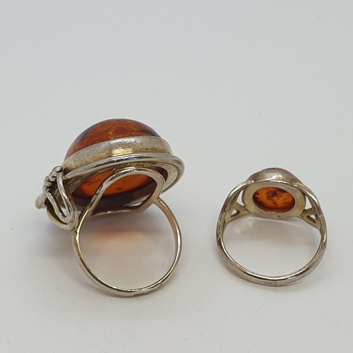 284 - Two Amber-set Silver Rings, no hallmarks, both ring size K, 12.5gms