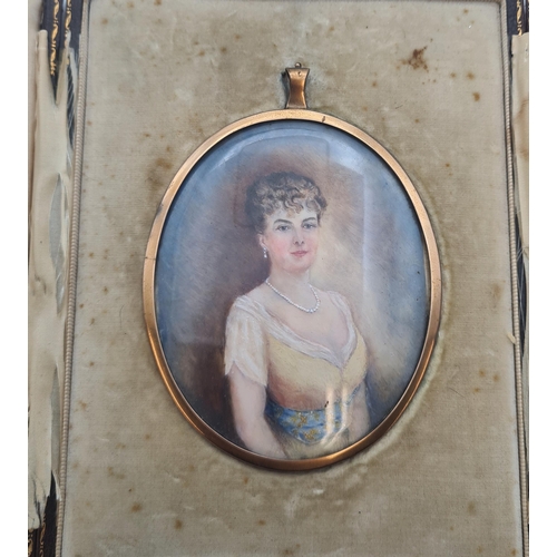 291 - An oval Miniature: half length painted Portrait of young lady wearing necklace, in gilt metal frame,... 