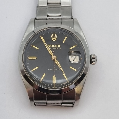 144 - A gentleman's 1950's Rolex Oysterdate Precision Wristwatch the black dial with gold baton markers, s... 