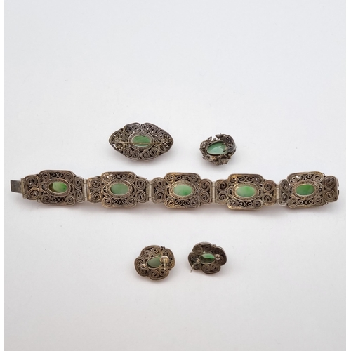 269 - A Silver Filigree and Jade Parure comprising panel bracelet, earrings, brooch and ring (A/F), approx... 