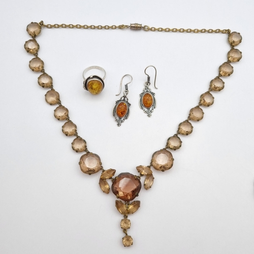 271 - An Amber Pendant, Earrings & Ring in silver stamped 925 with a silver curblink chain stamped 925 and... 