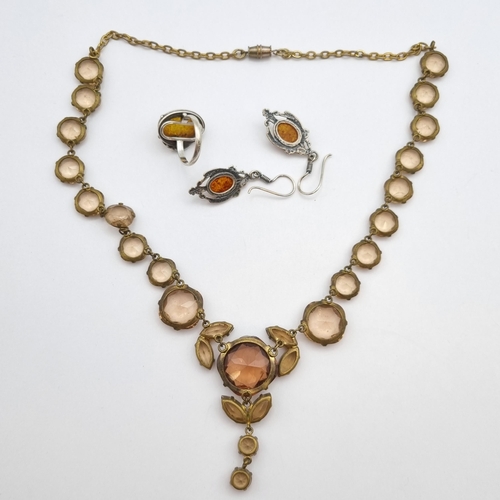 271 - An Amber Pendant, Earrings & Ring in silver stamped 925 with a silver curblink chain stamped 925 and... 