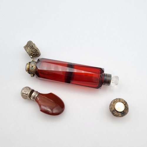 293 - A ruby glass double ended Scent Bottle with embossed white metal mounts and an Agate Snuff Bottle wi... 