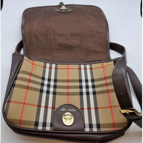 299 - A Burberry satchel style Handbag in 'Burberry' check with brown leather, adjustable shoulder strap, ... 