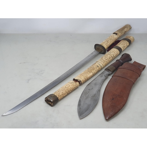 1078 - An antique Japanese Wakizashi with carved bone grip and scabbard A/F 25 1/2in L overall and a Kukri ... 