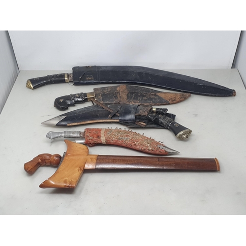 1081 - Four assorted Kukris and a Kris with hardwood grip and scabbard A/F