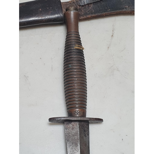 1051 - A British Commando Knife, with one piece ribbed grip, marked with cross keys and star over D on grip... 