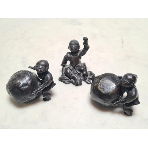 861 - A pair of Chinese bronze Figures of children with boulders, 2in H, and another of a seated child, 2 ... 