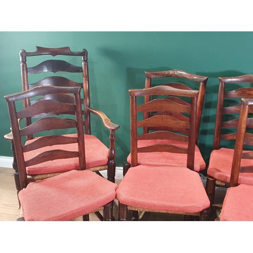 567 - A set of eight 19th Century ash and elm ladderback Chairs with rush seats and squab cushions on turn... 